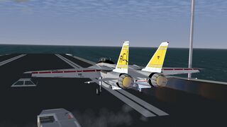 Locked in catapult, flaps set, full afterburner, ready for take-off.