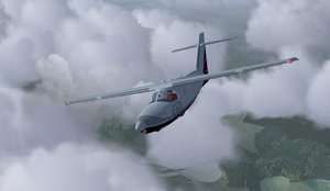 Extra 500 flying in clouds