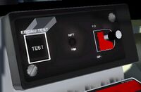Engine panel with EBCAU TEST button and guard open